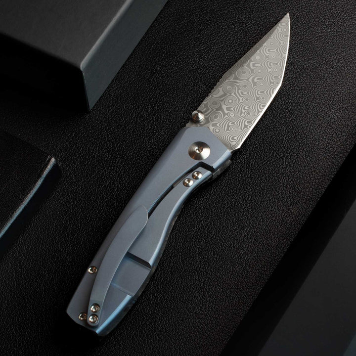Delos Damascus knives Dark Matter Blue