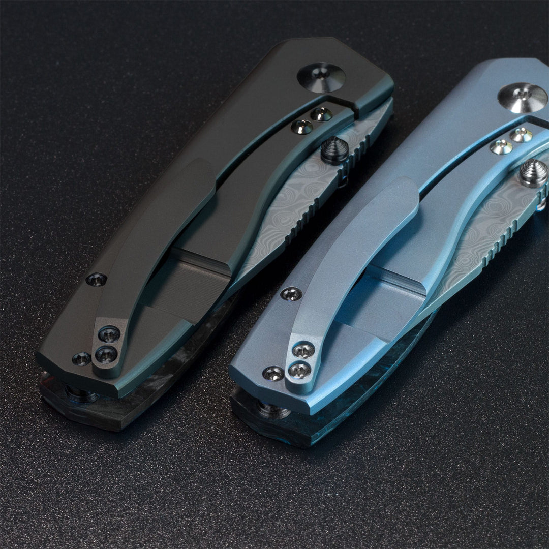 Delos Damascus knives Black Dunes and blue titanium