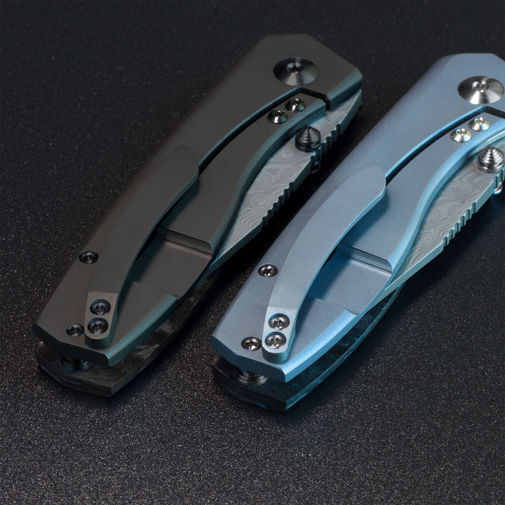 Delos Damascus knives Black Dunes and blue titanium