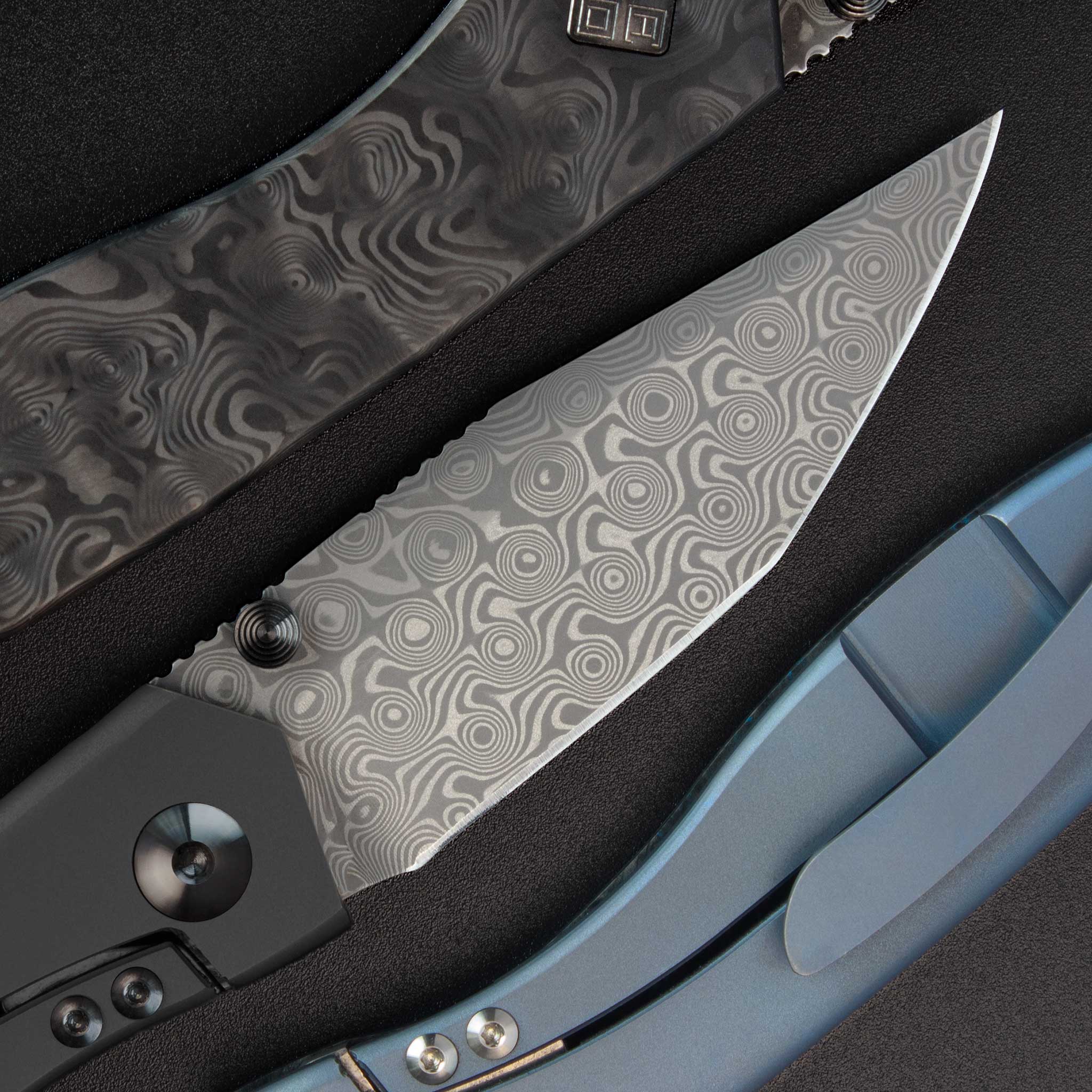 Delos Damascus and Titanium knives